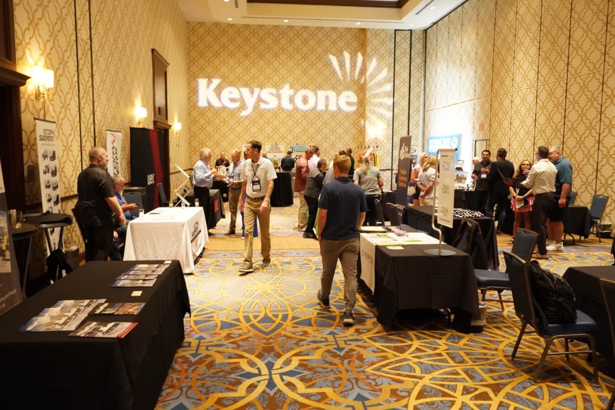 Attendees networking at the indoor exhibitor expo hall