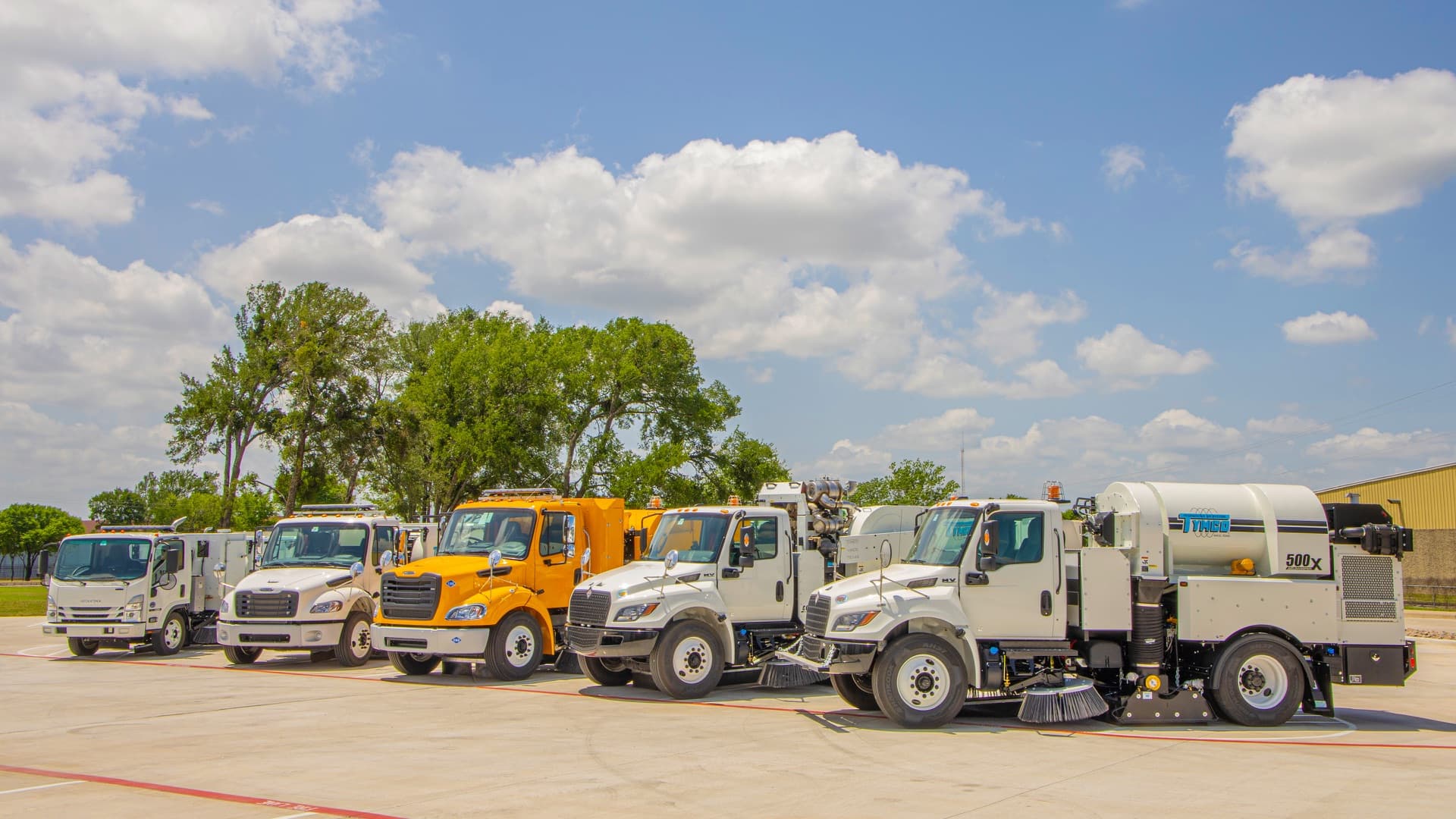 TYMCO regenerative air sweeper fleet lined up outside the factory in Waco, Texas